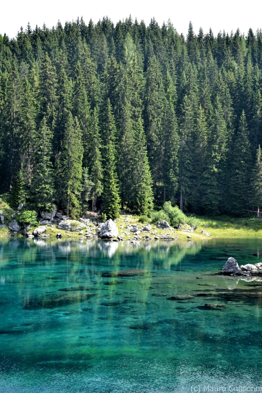 Lake of Carezza (Karersee). The lake has no visible tributaries and is fed by subterraneous springs from the Latemar mountain chain